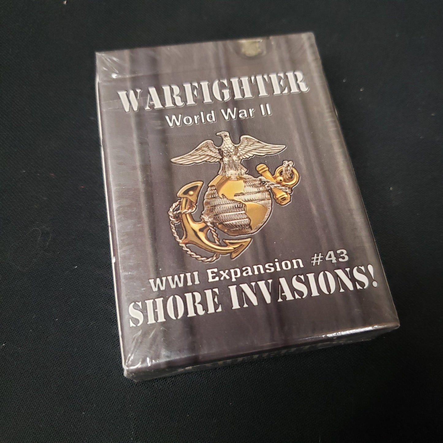 Image shows the front of the package for the Shore Invasions Expansion Pack for the Warfighter: WWII card game
