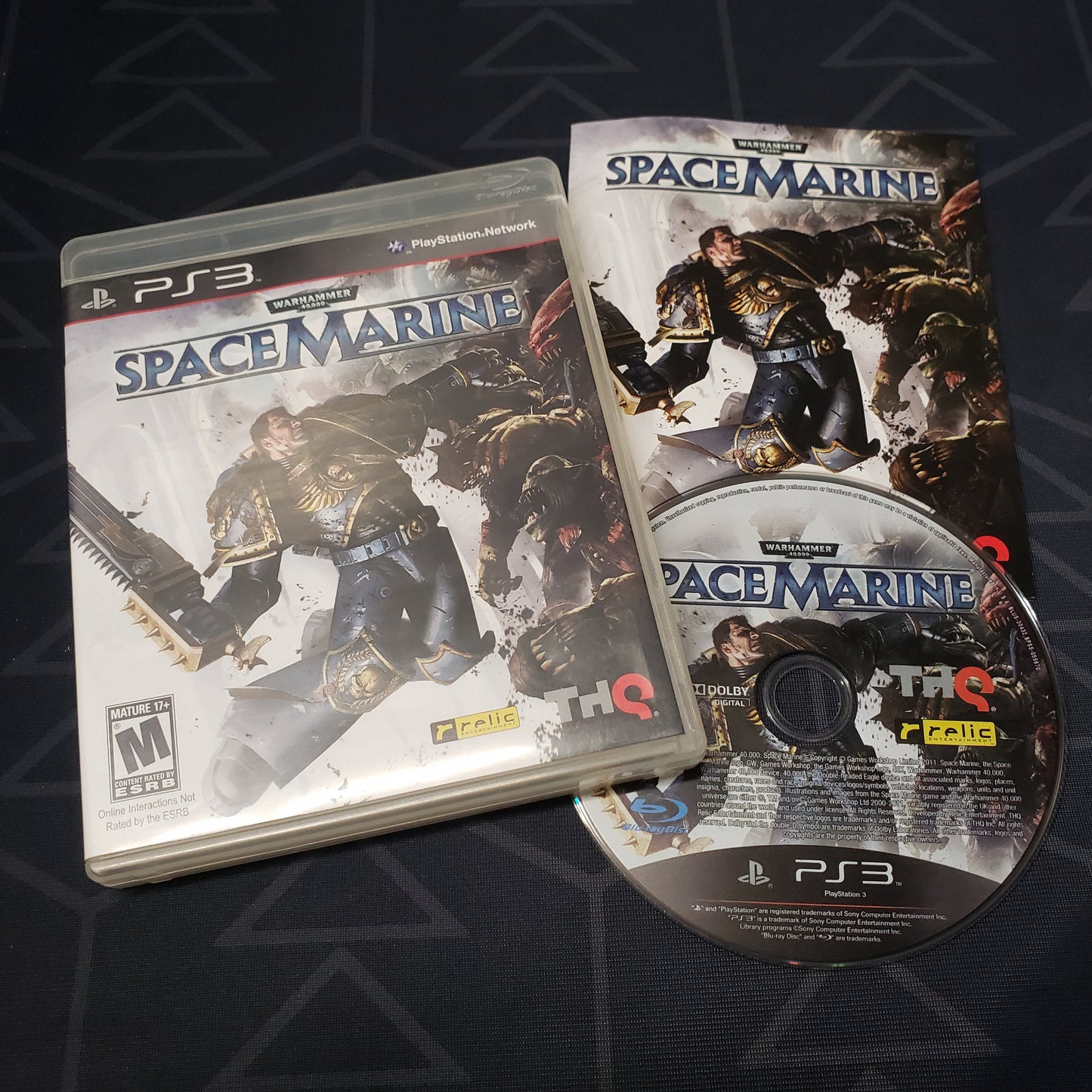Image shows the case, manual and disc for the video game Warhammer 40,000: Space Marine for Playstation 3