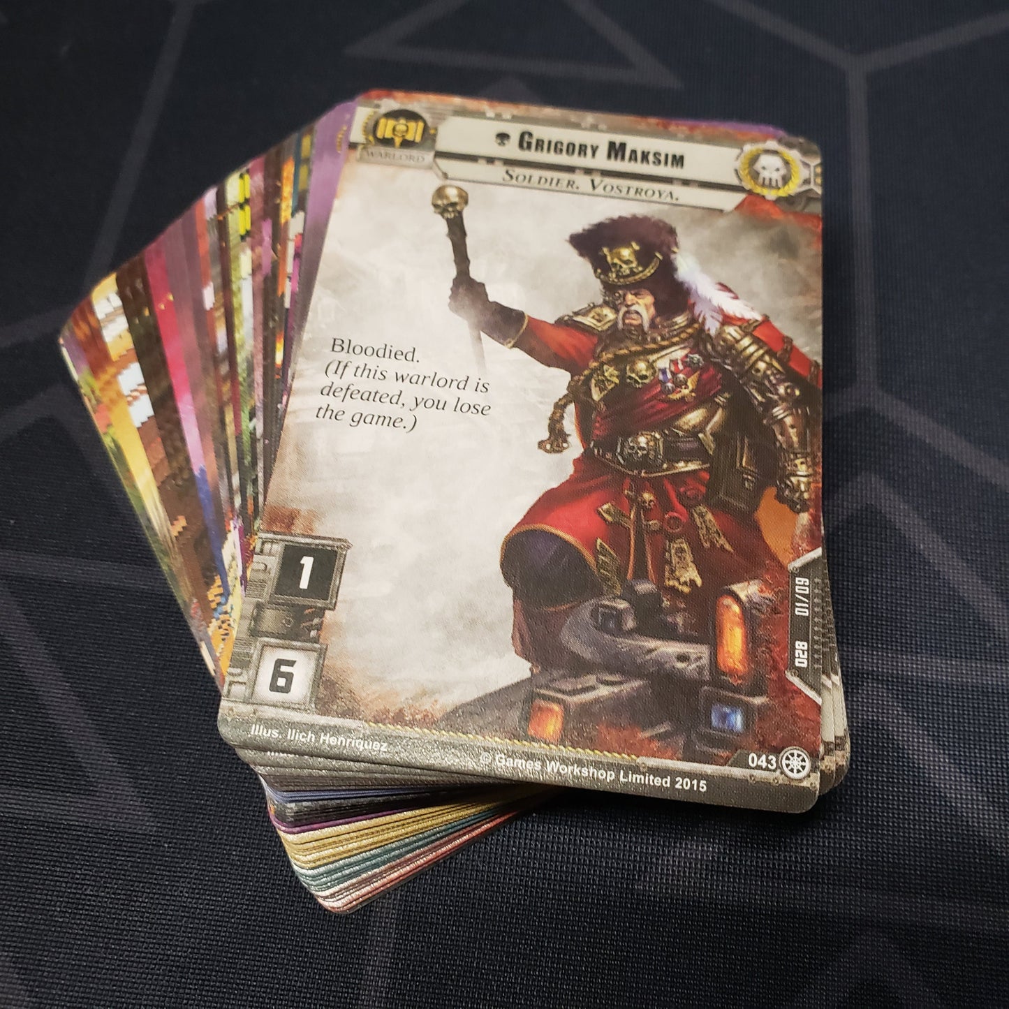 Image shows the cards for the Slash and Burn expansion for the card game Warhammer 40K Conquest fanned out in a stack