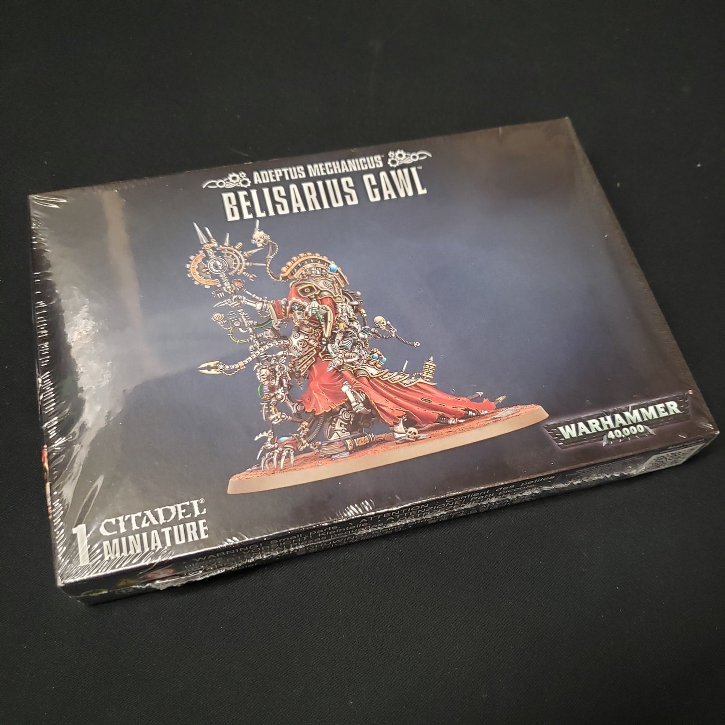 Image shows the front of the package for the Belisarius Cawl expansion pack for the Warhammer 40K miniatures game