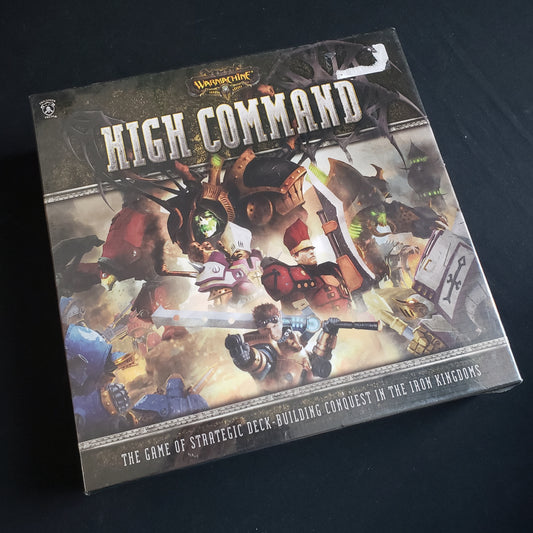 Image shows the front cover of the box of the card game Warmachine: High Command