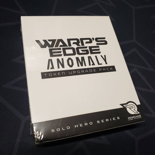 Image shows the front cover of the box of the Anomaly expansion Token Upgrade Pack for the board game Warp's Edge