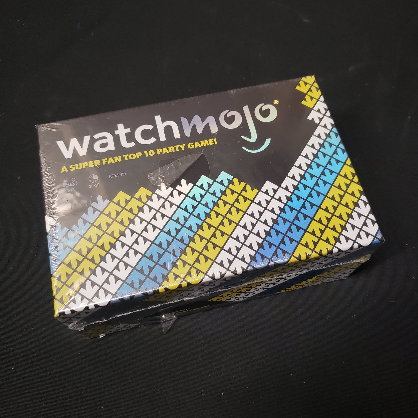 Image shows the front cover of the box of the WatchMojo card game