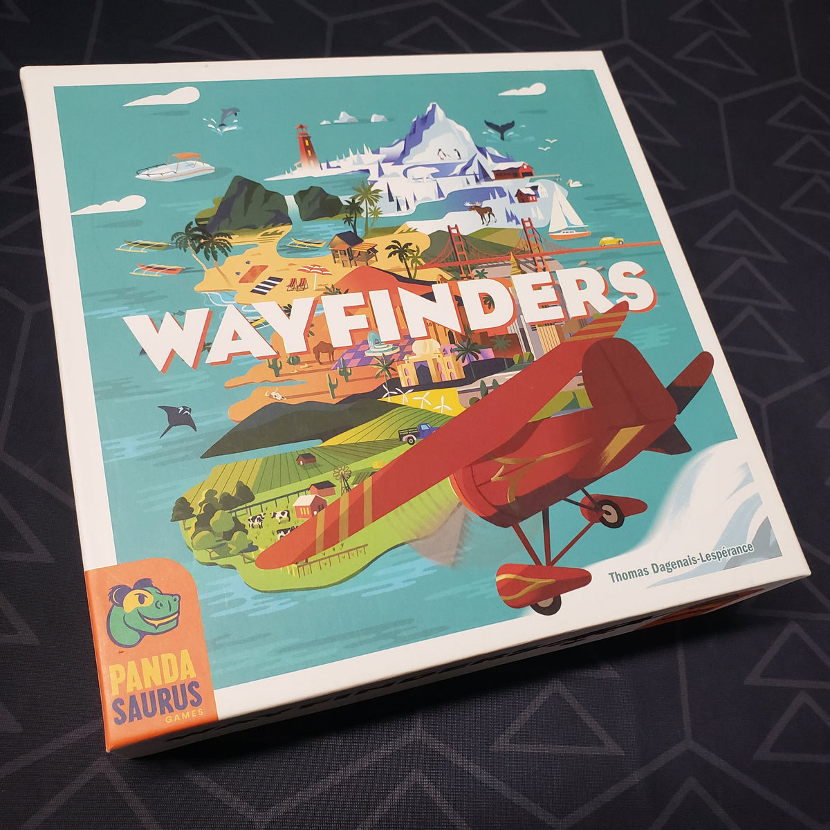 Image shows the front cover of the box of the Wayfinders board game
