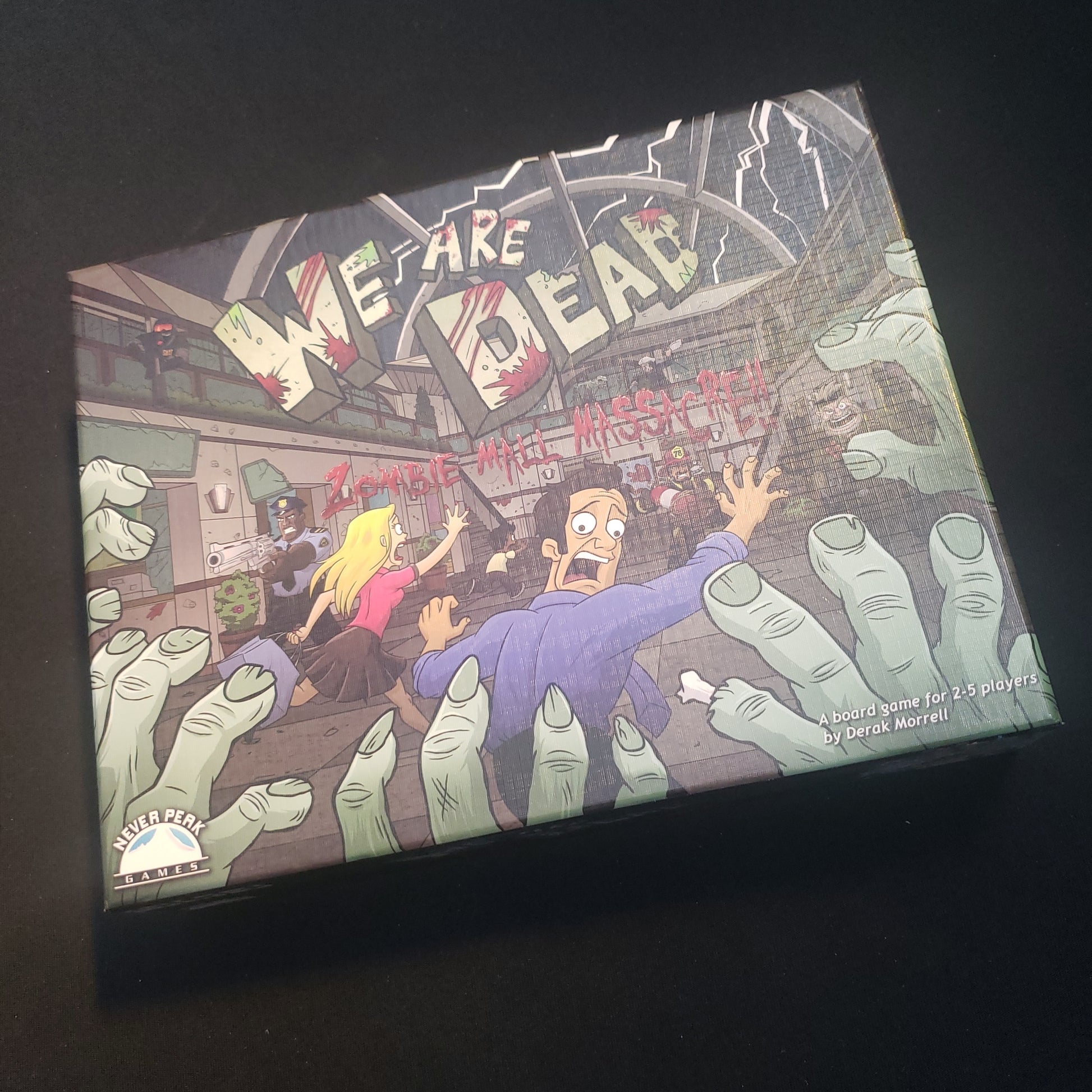 Image shows the front cover of the box of the We Are Dead: Zombie Mall Massacre board game