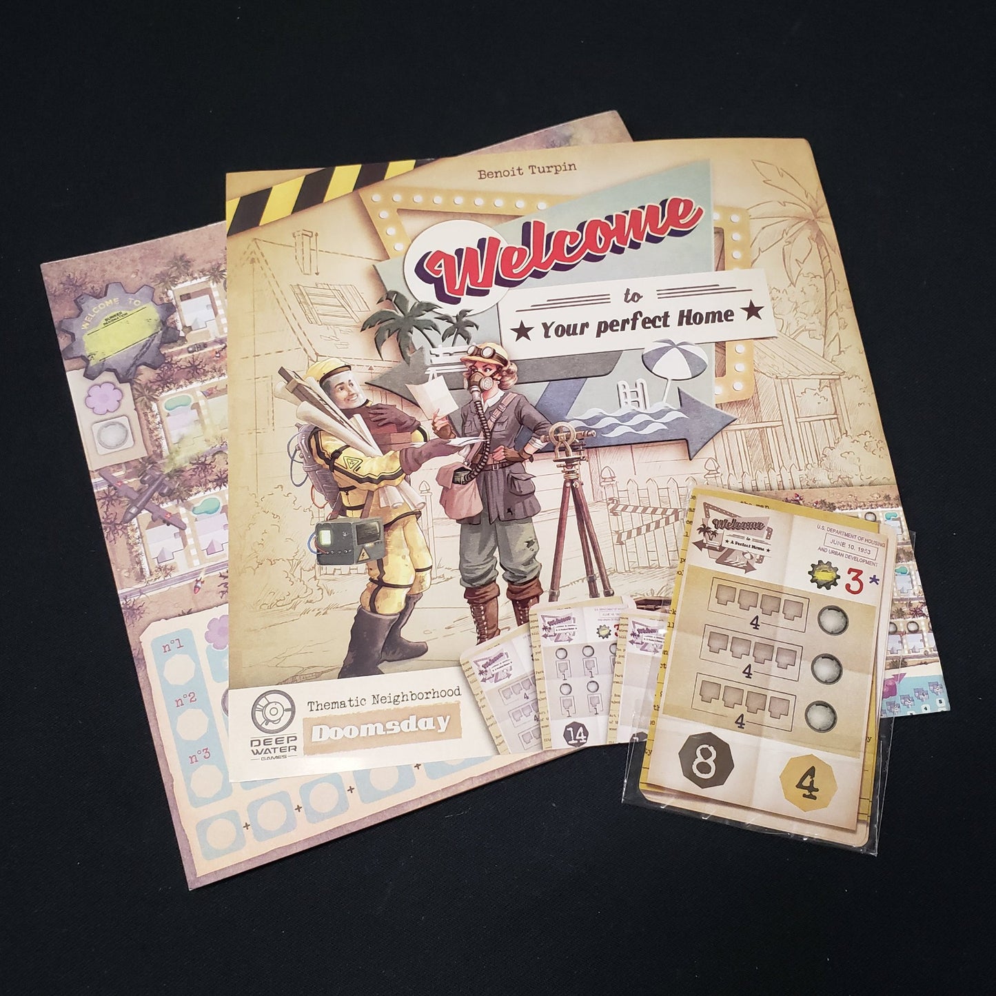 Image shows the score pad, instruction sheet and cards for the Doomsday expansion for the board game Welcome To…