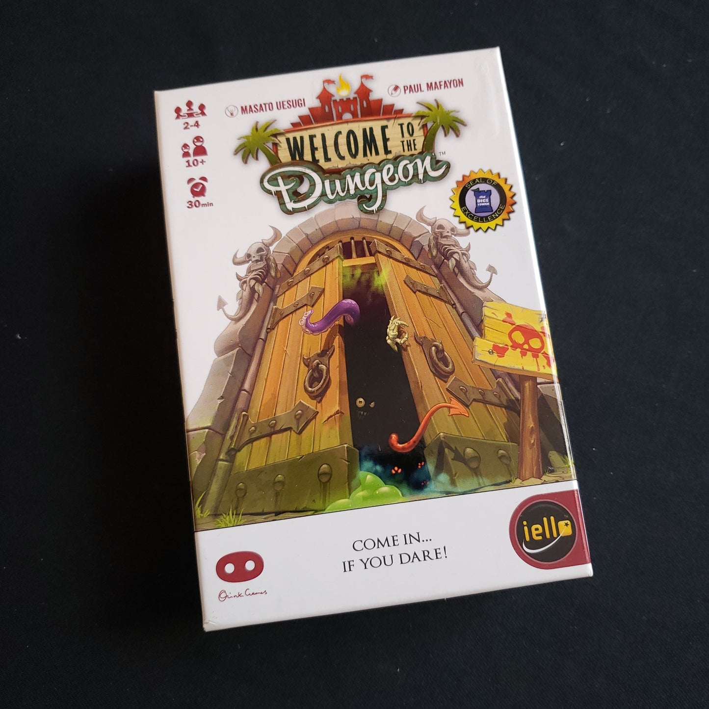 Image shows the front cover of the box of the Welcome to the Dungeon card game