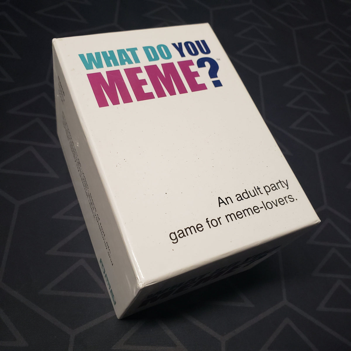Image shows the front cover of the box for the What Do You Meme? card game