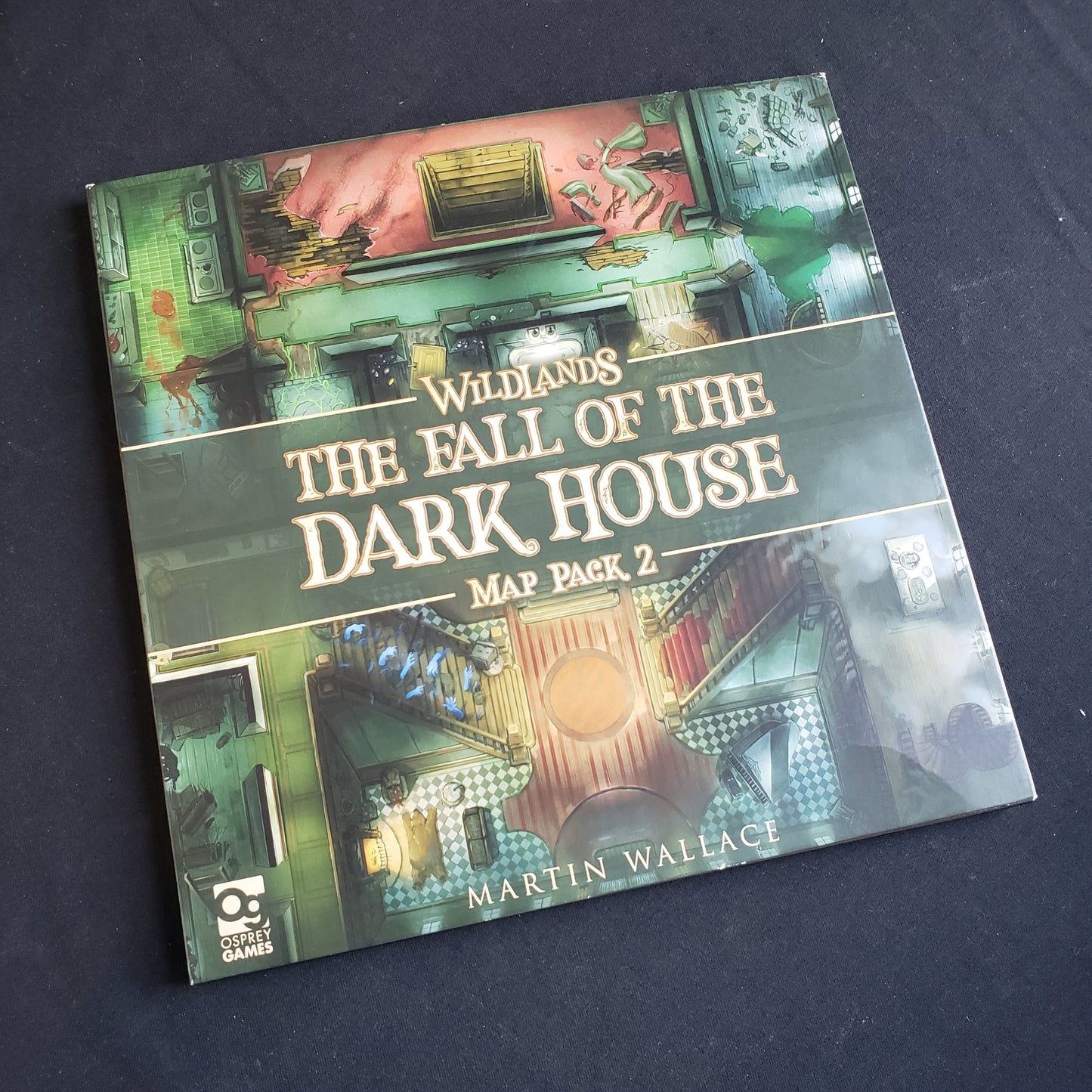 Image shows the front cover of the package of the Fall of the Dark House map pack for the board game Wildlands
