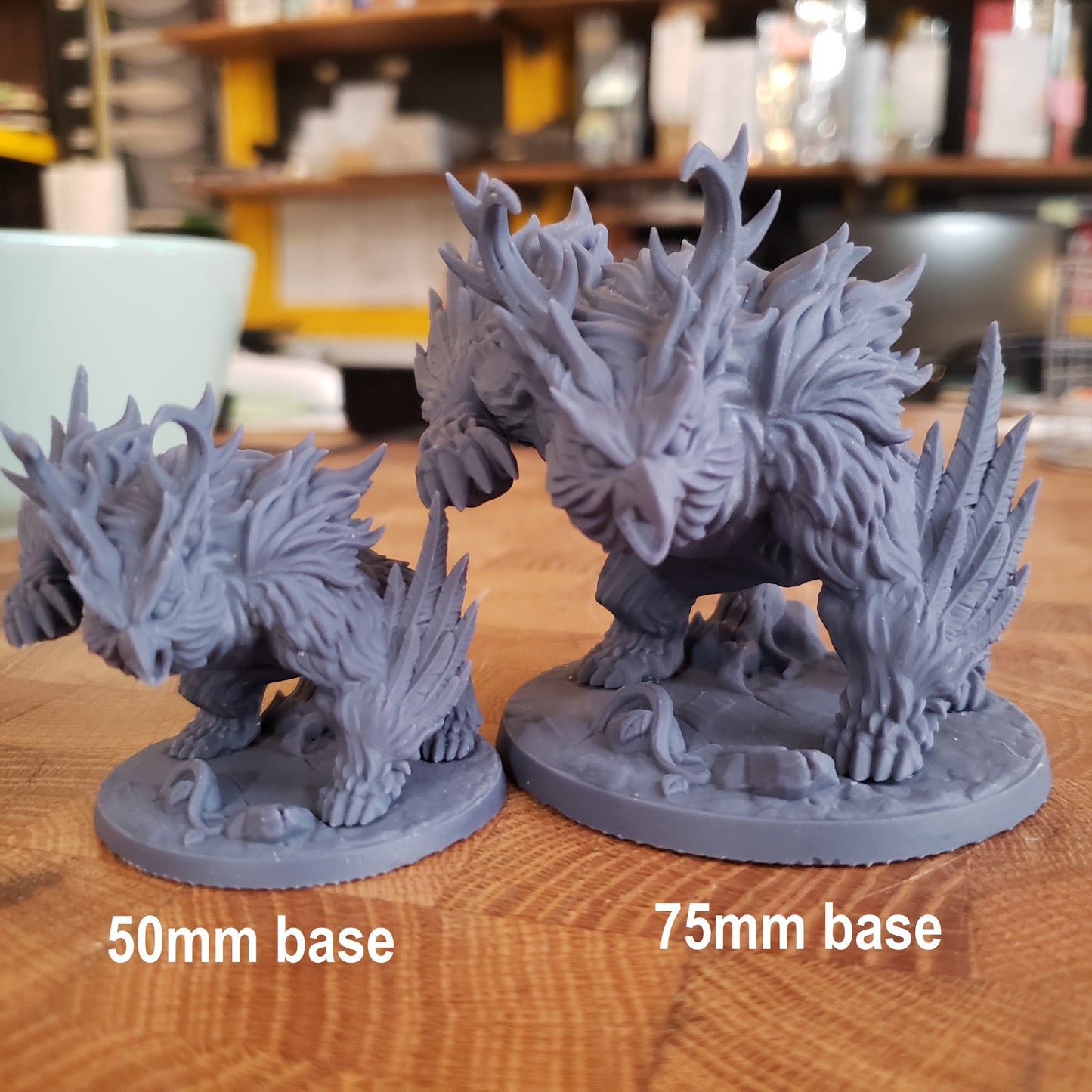 Image shows two different sized examples of a 3D printed owlbear gaming miniature printed in-house at All Systems Go