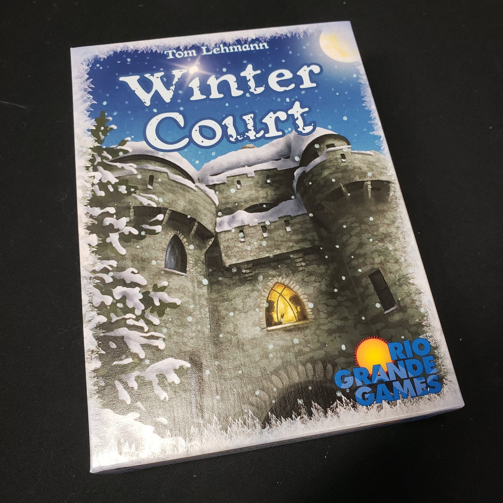 Image shows the front cover of the box of the Winter Court board game