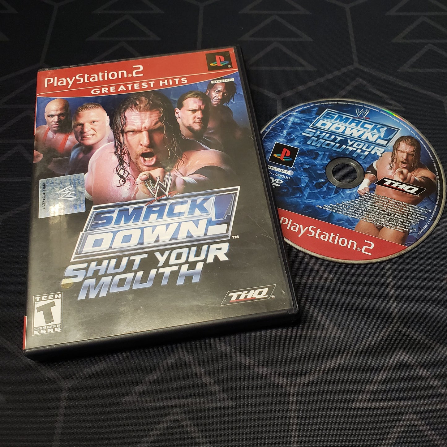 Image shows the case & disc for the video game WWE Smackdown!: Shut Your Mouth for Playstation 2