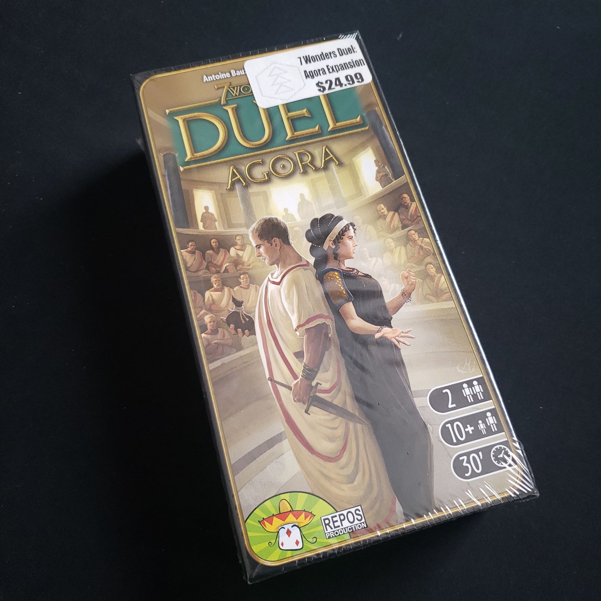 Image shows the front cover of the box of the Agora expansion for the board game 7 Wonders Duel