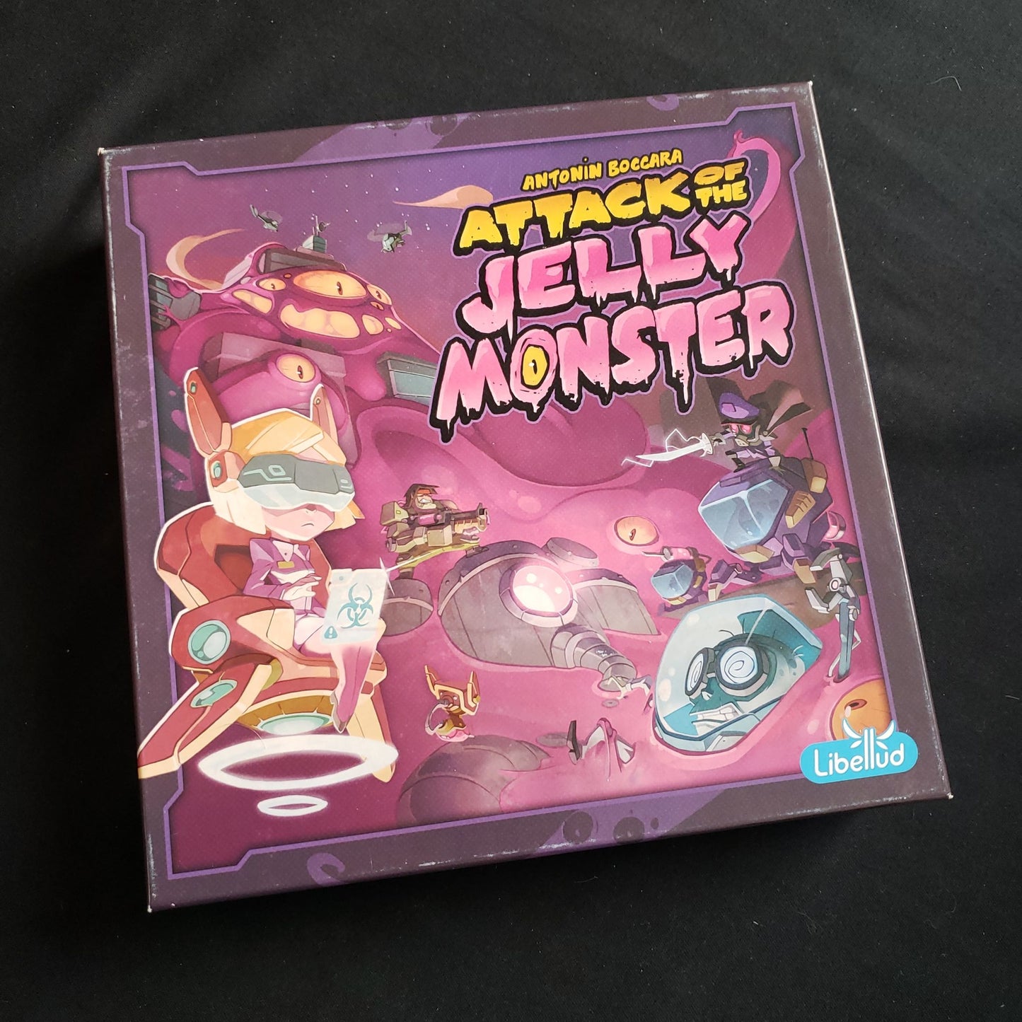 Image shows the front cover of the box of the Attack of the Jelly Monster board game