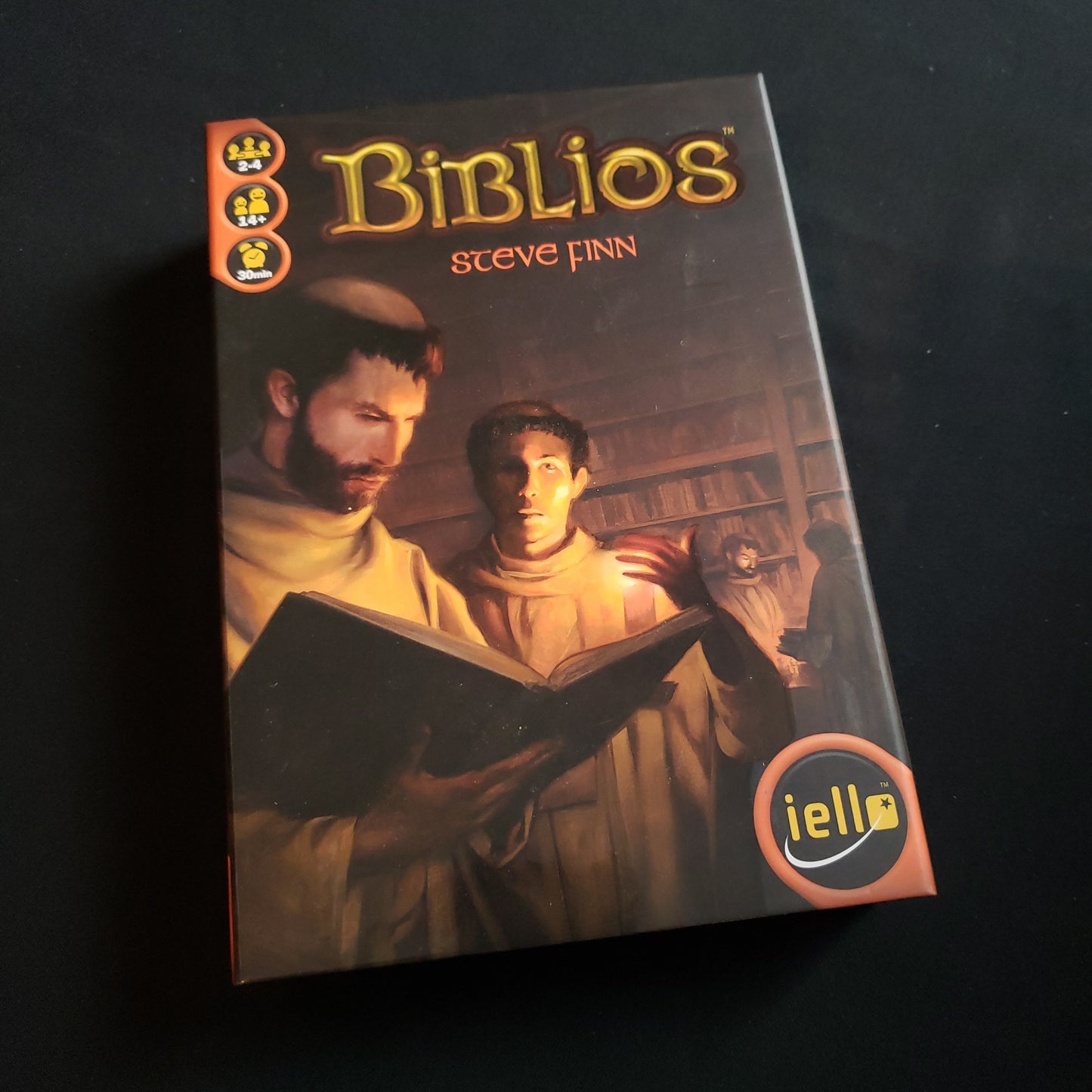 Image shows the front cover of the box of the Biblios board game