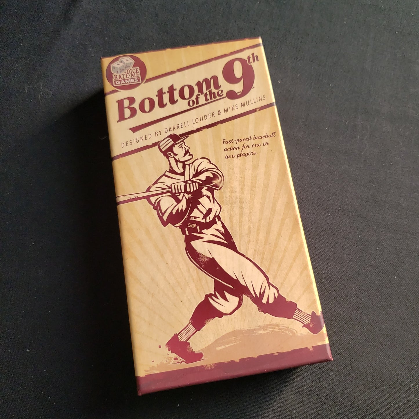 Image shows the front cover of the box of the Bottom of the Ninth card game