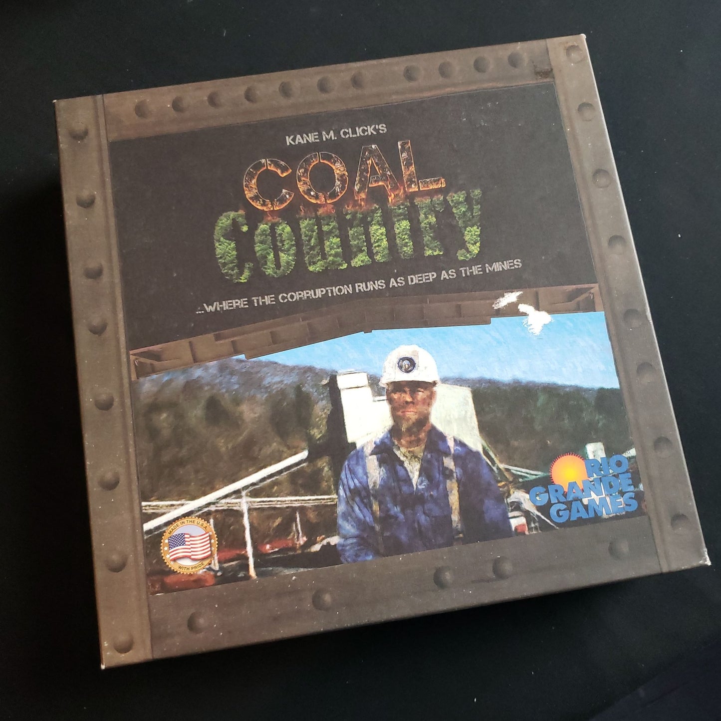 Image shows the front cover of the box of the Coal Country board game