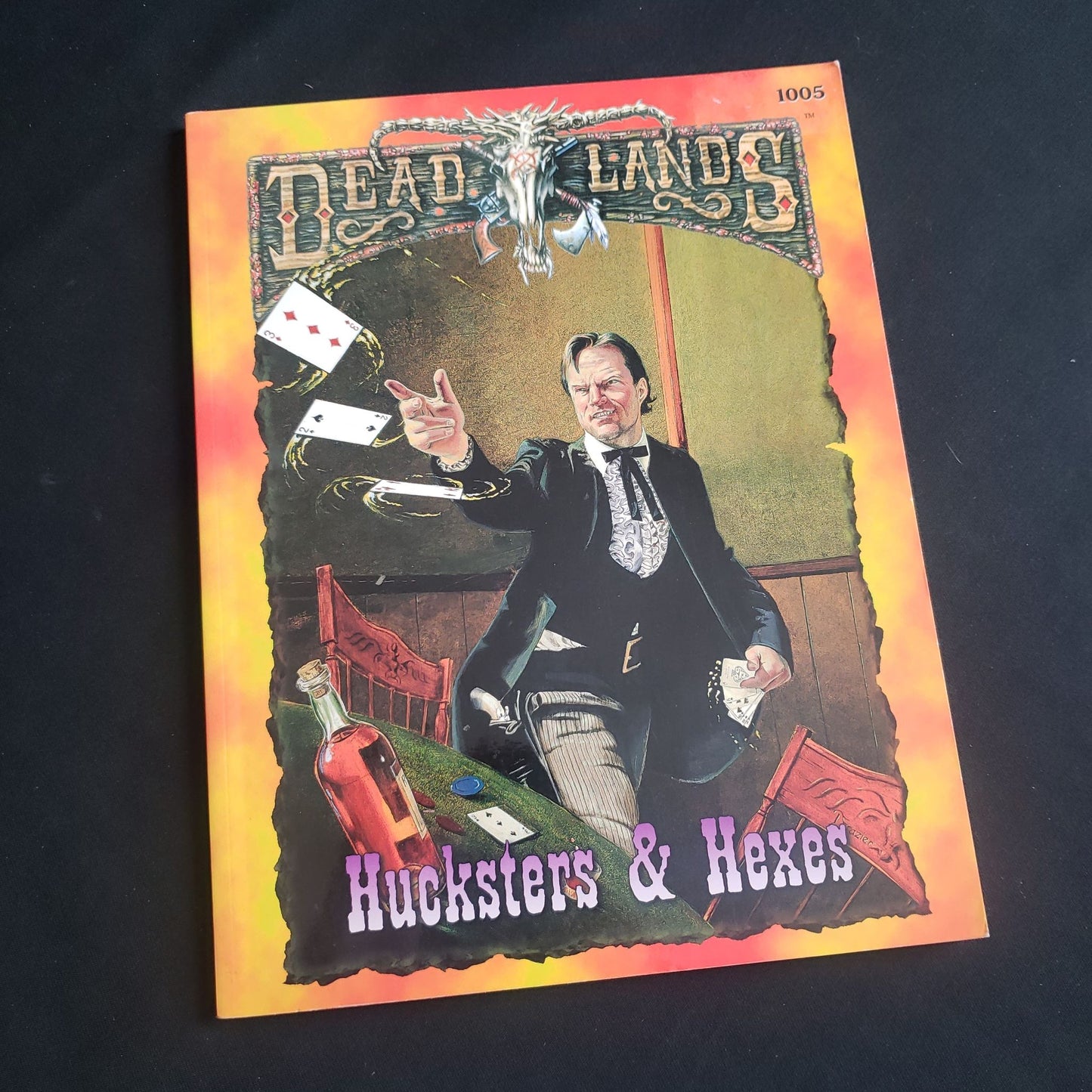 Image shows the front cover of the Hucksters & Hexes book for the Deadlands roleplaying game