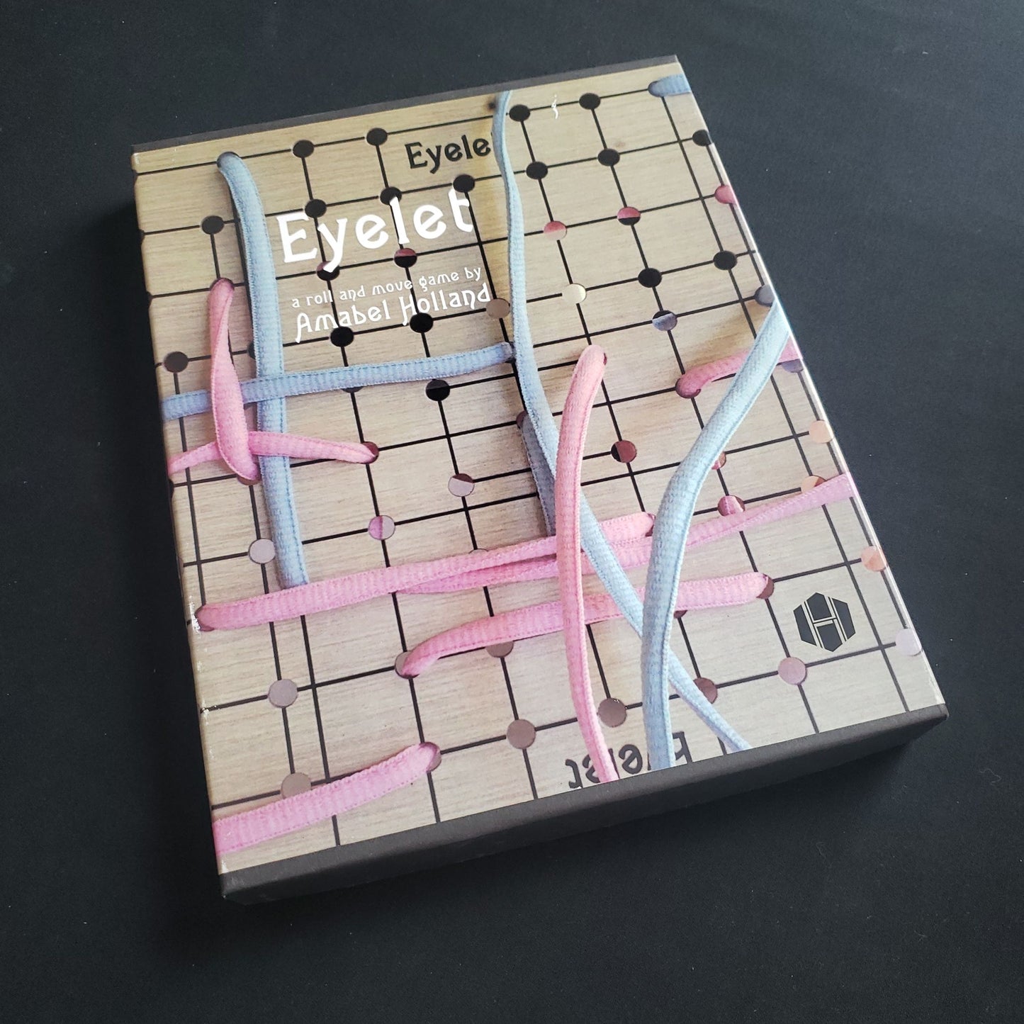 Eyelet board game - front cover of box