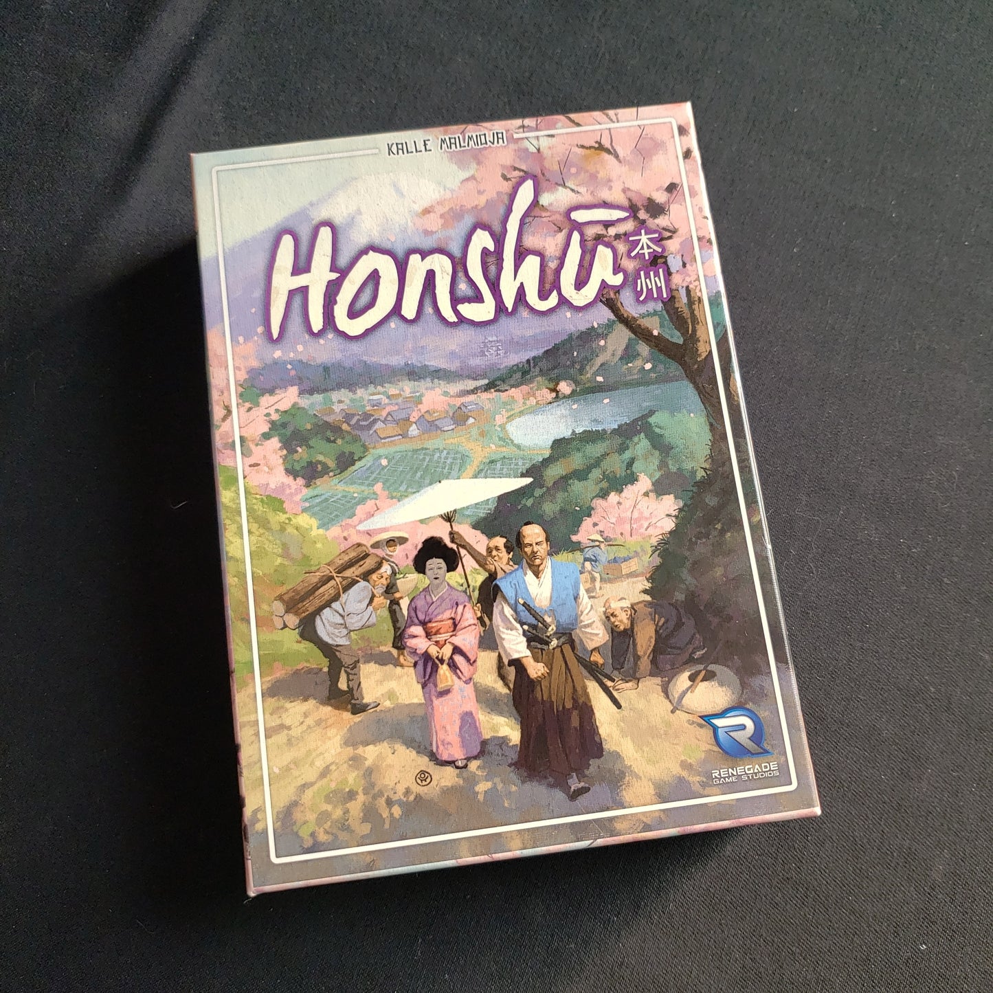 Image shows the front cover of the box of the Honshu card game