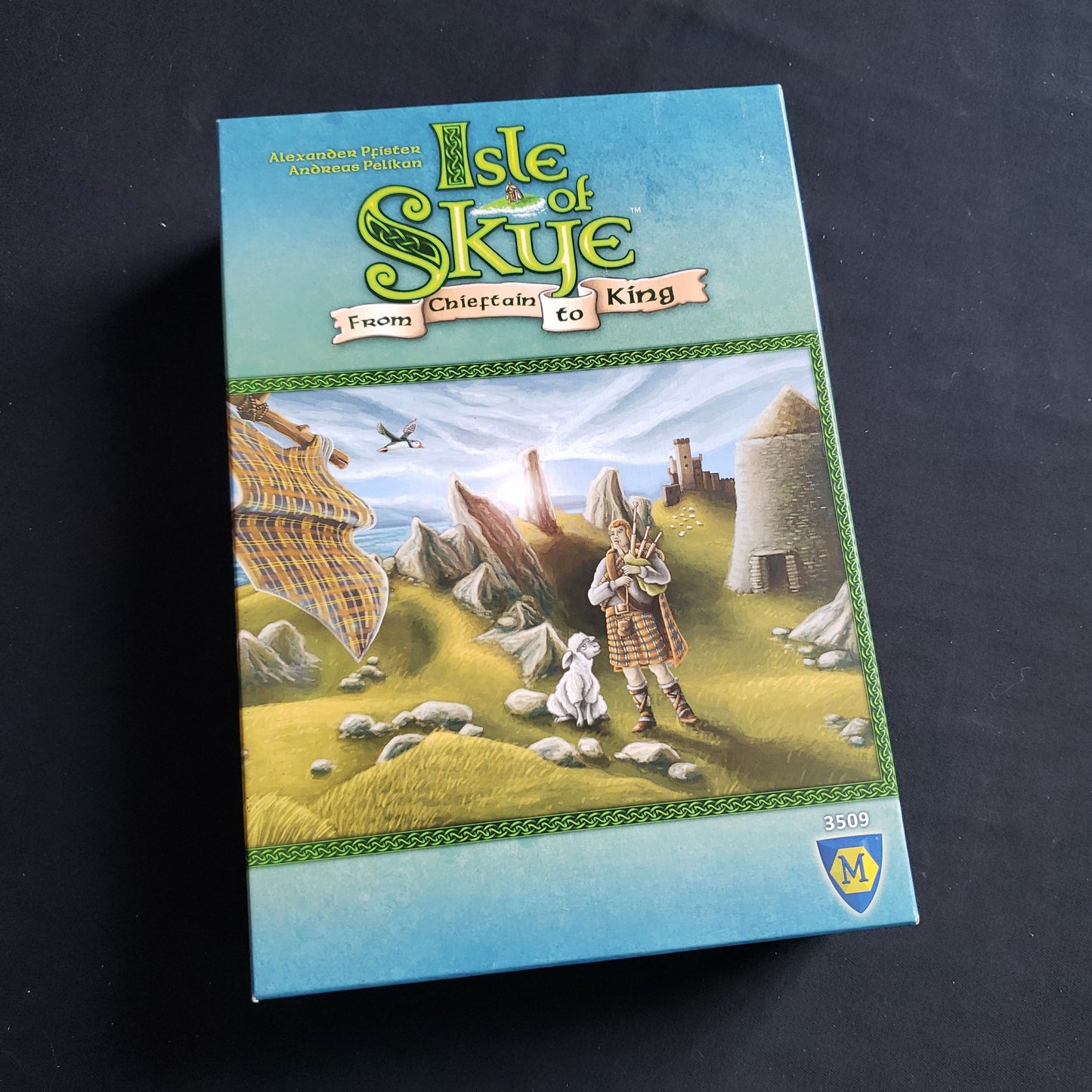 Image shows the front cover of the box of the Isle of Skye board game