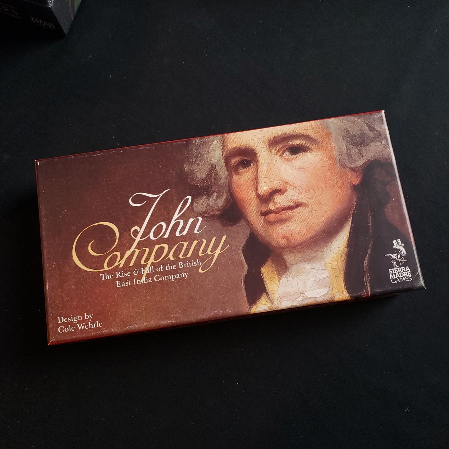 Image shows the front cover of the box of the John Company: First Edition board game