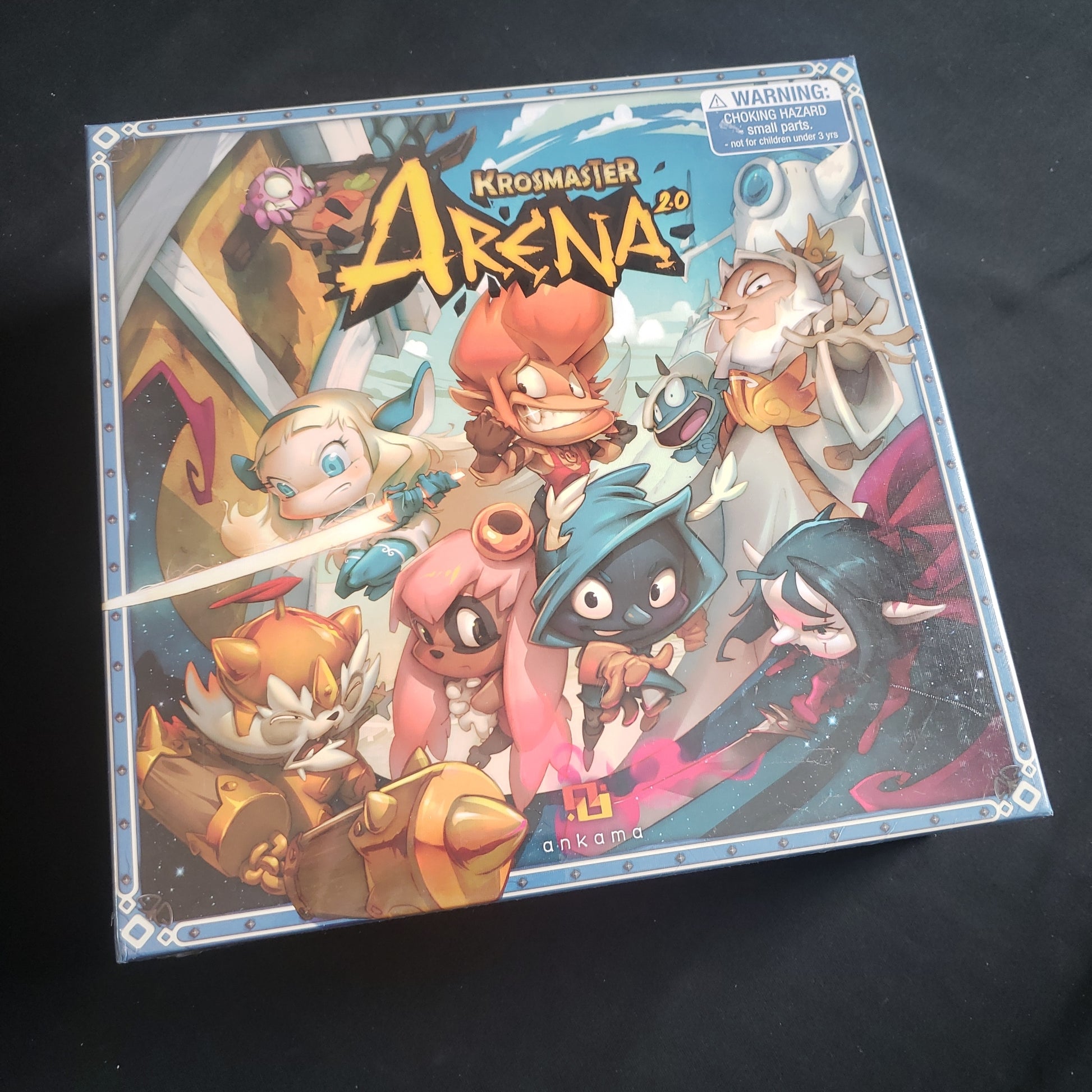 Image shows the front cover of the box of the Krosmaster Arena 2.0 board game