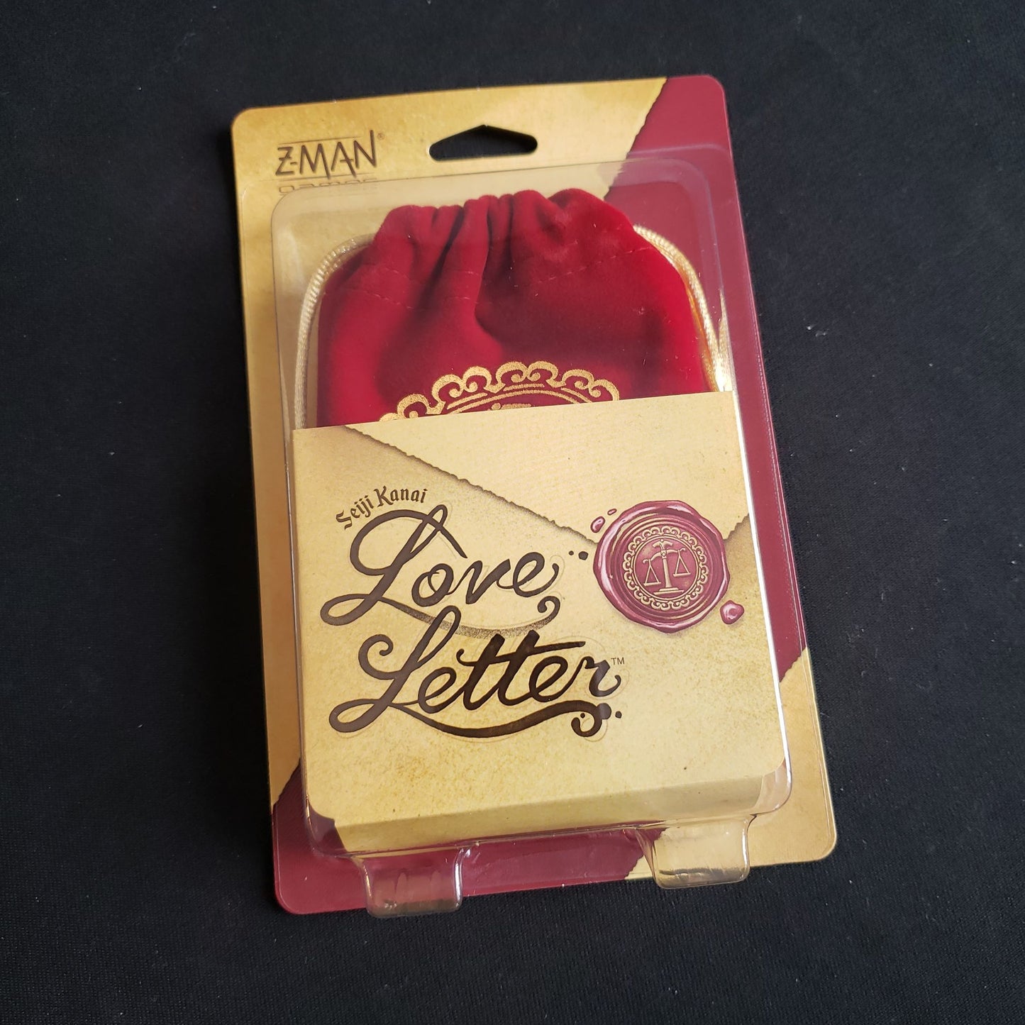Image shows the front cover of the box of the Love Letter card game