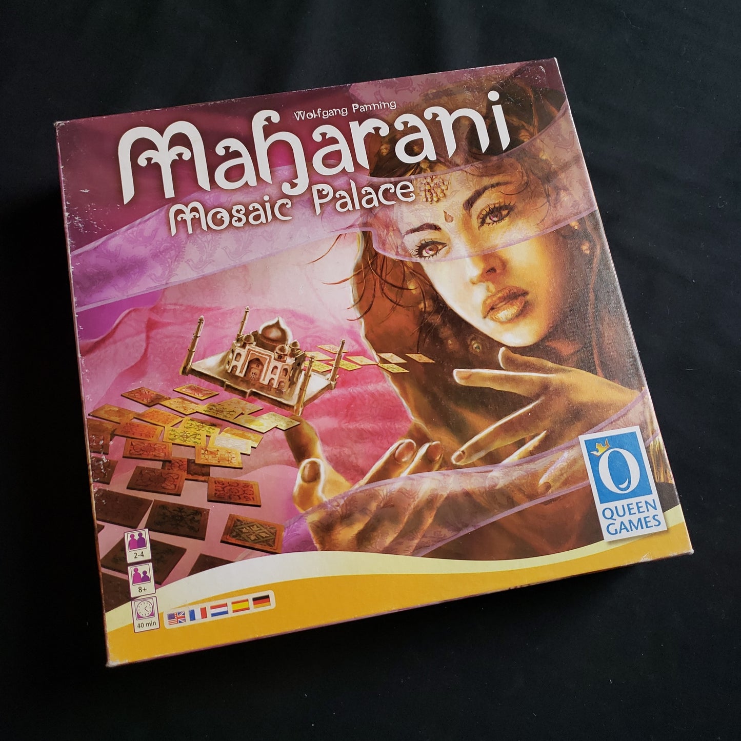 Image shows the front cover of the box of the Maharani board game