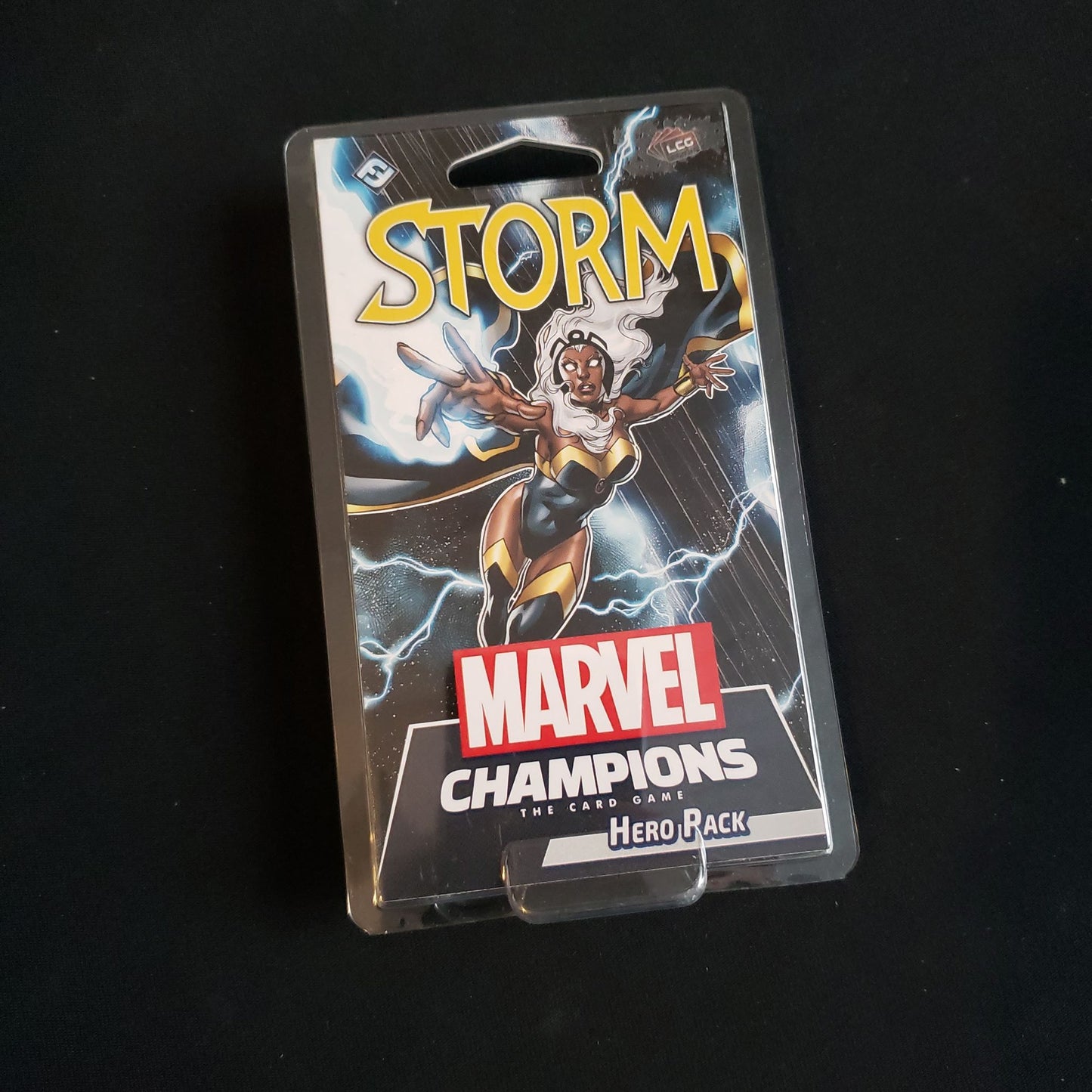 Image shows the front of the package for the Storm Hero Pack for the Marvel Champions card game