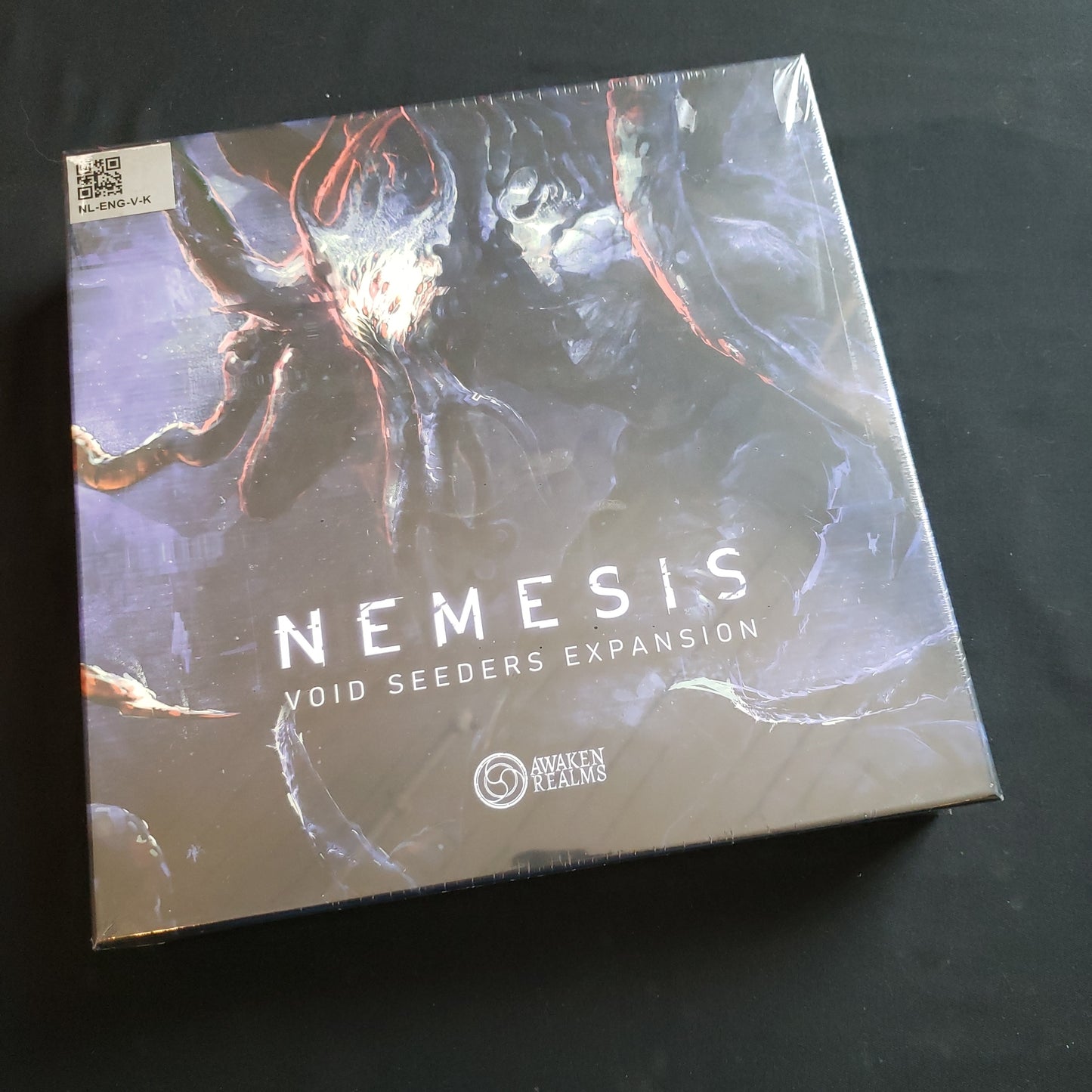 Image shows the front cover of the box of the Void Seeders expansion for the Nemesis board game