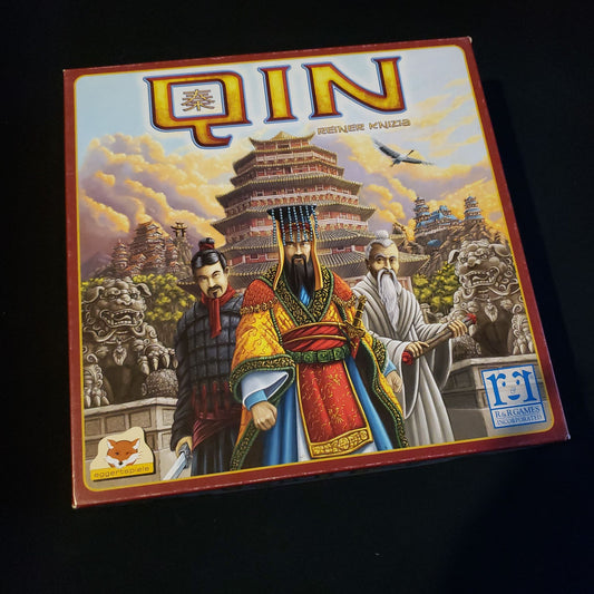 Image shows the front cover of the box of the Qin board game