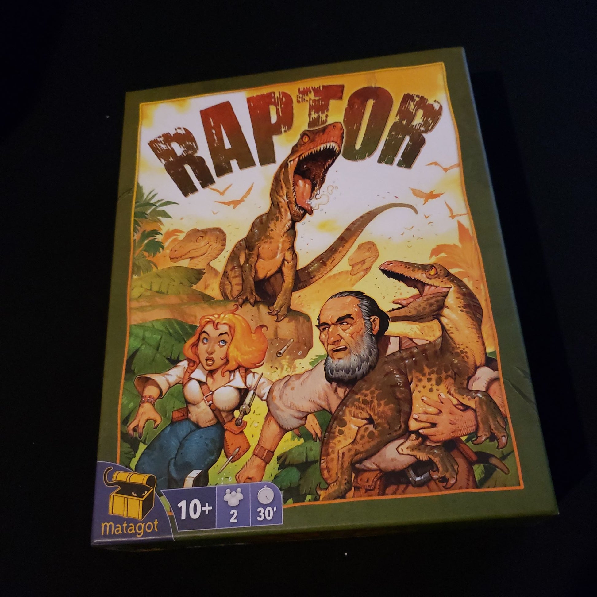 Image shows the front cover of the box of the Raptor board game
