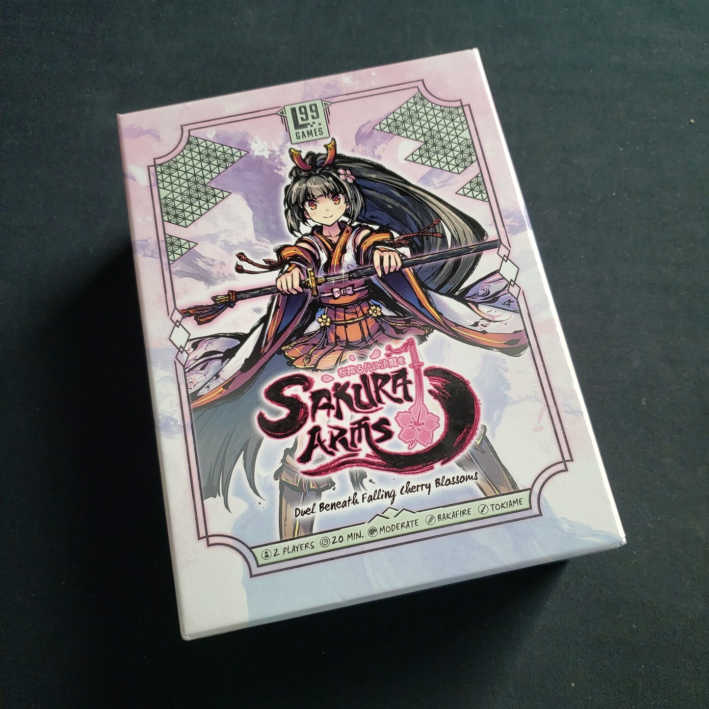 Image shows the front cover of the Yurina Box for the Sakura Arms card game