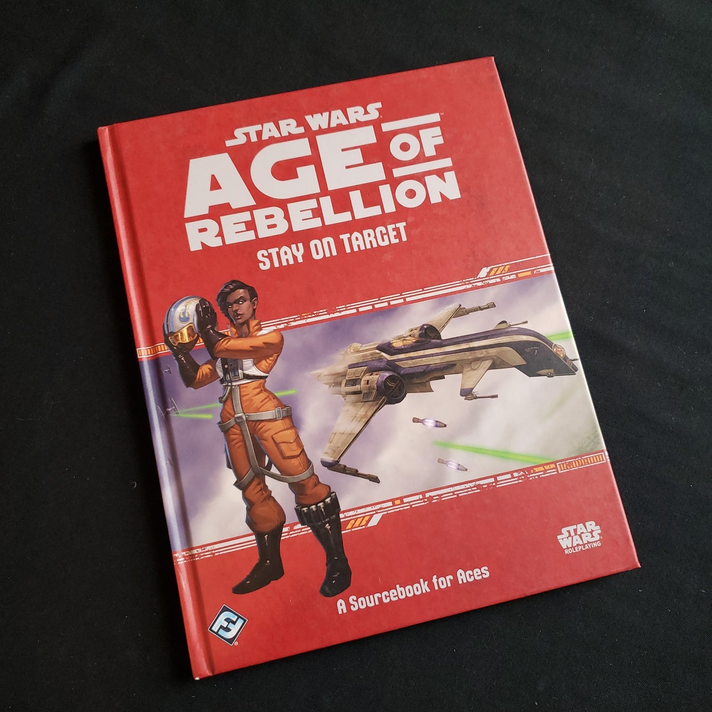 Image shows the front cover of the Stay on Target book for the Star Wars: Age of Rebellion roleplaying game