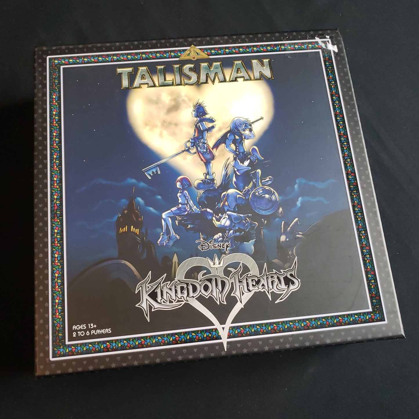 Image shows the front cover of the box of the Talisman: Kingdom Hearts board game
