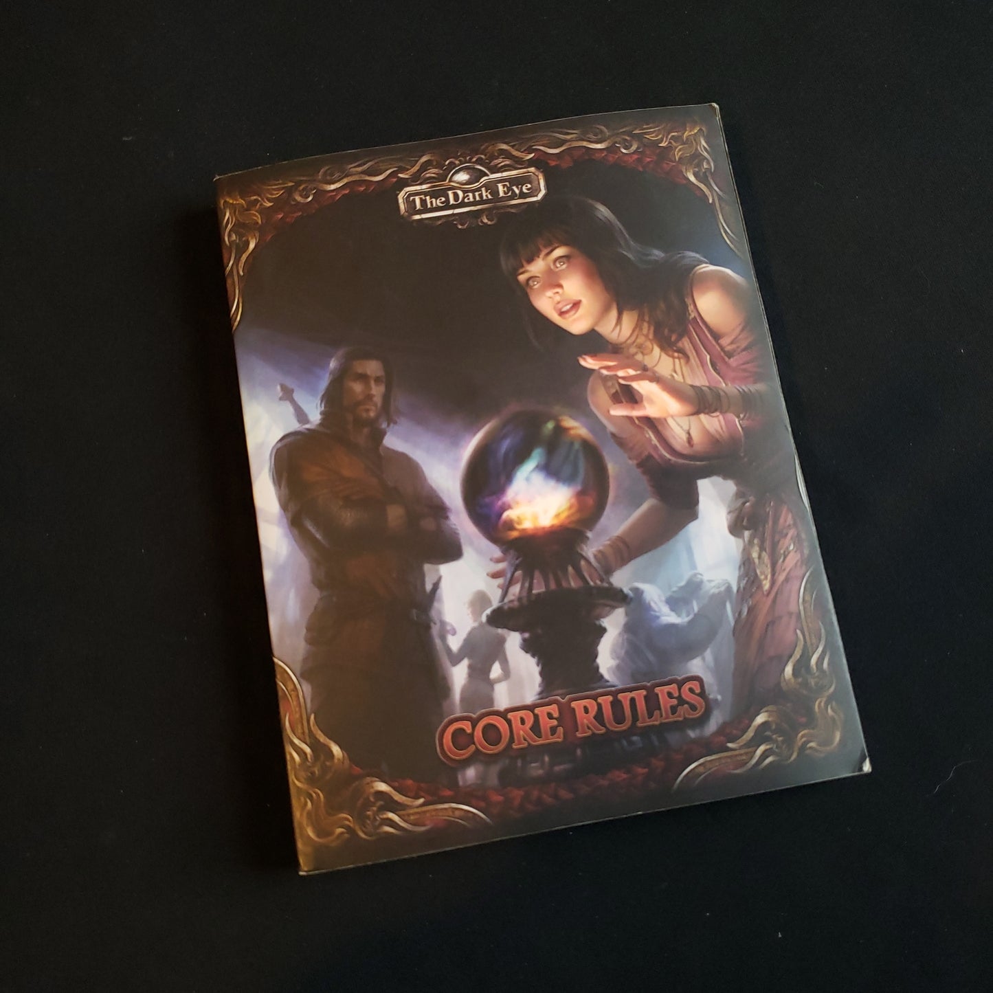 Image shows the front cover of the pocket edition of the Core Rules book for the Dark Eye roleplaying game
