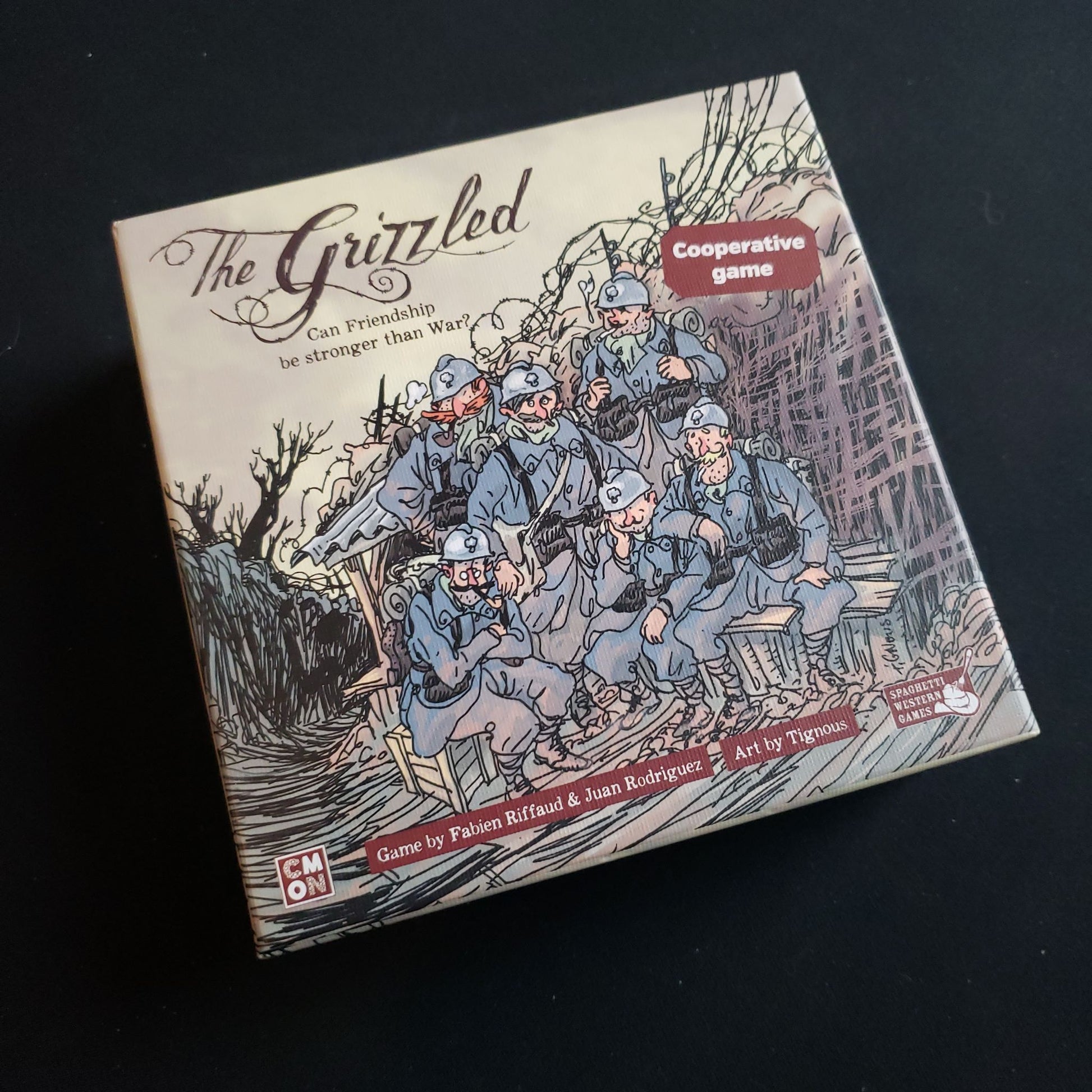 Image shows the front cover of the box of the Grizzled card game