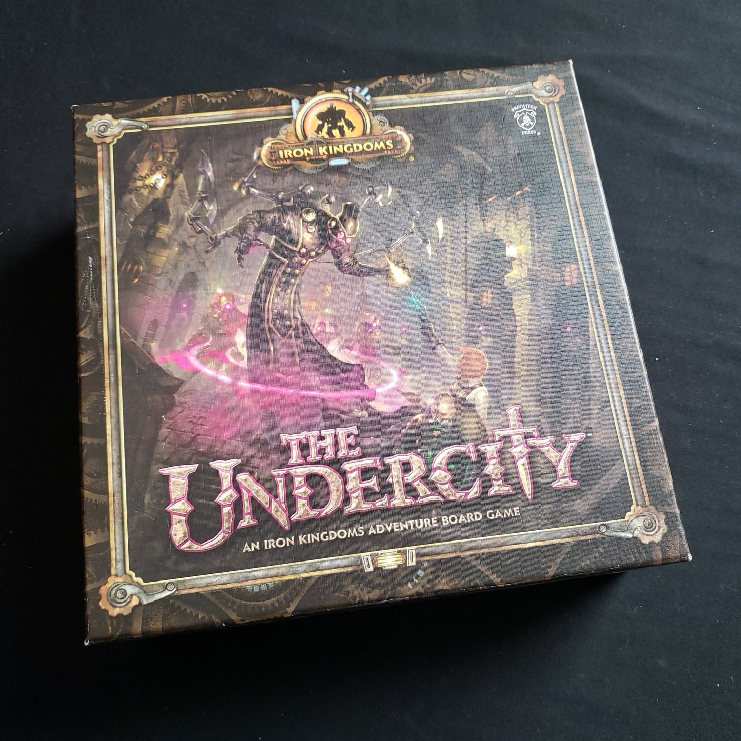 Image shows the front cover of the box of the Undercity board game