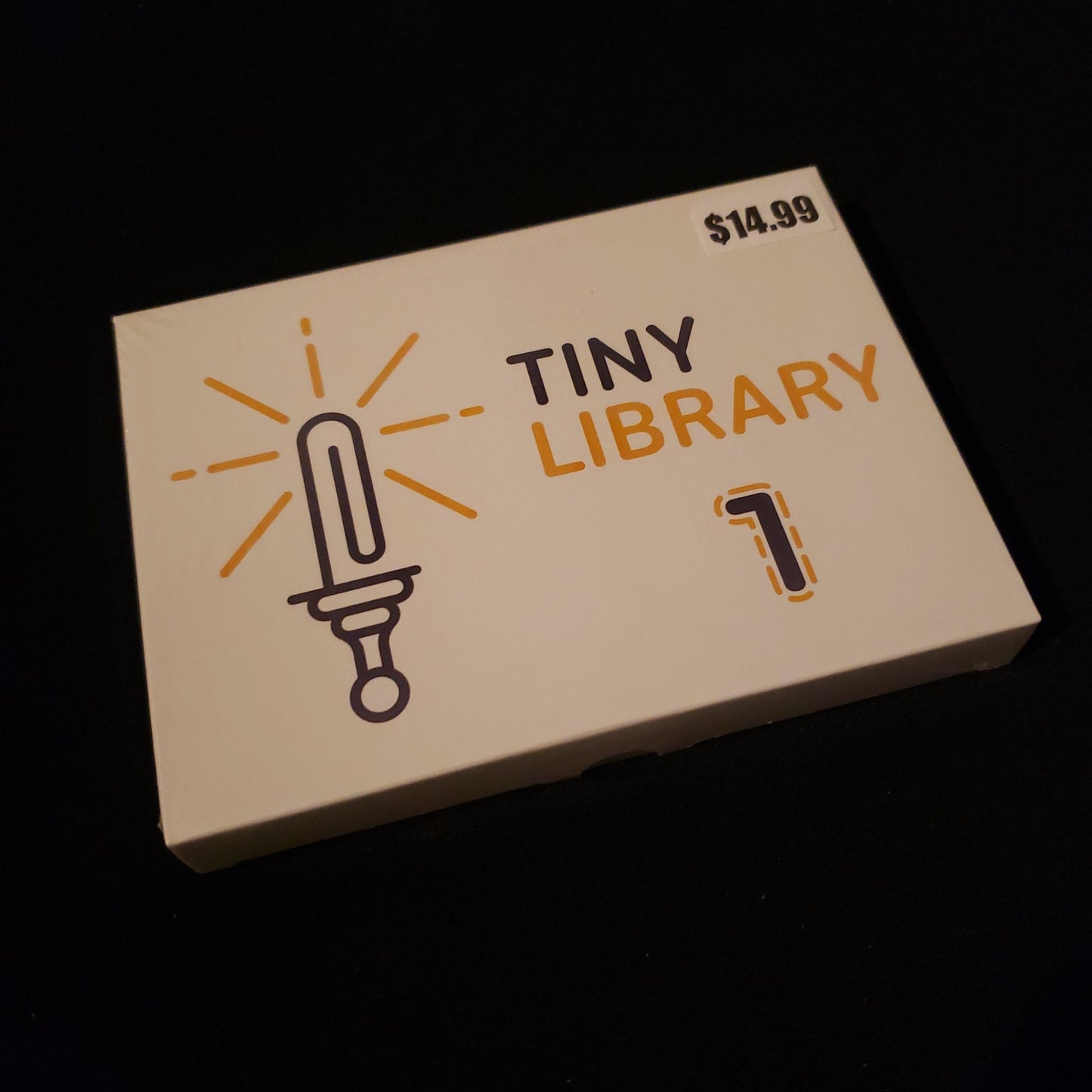 Tiny Library Volume 1 - set of micro rpgs - front cover of card box