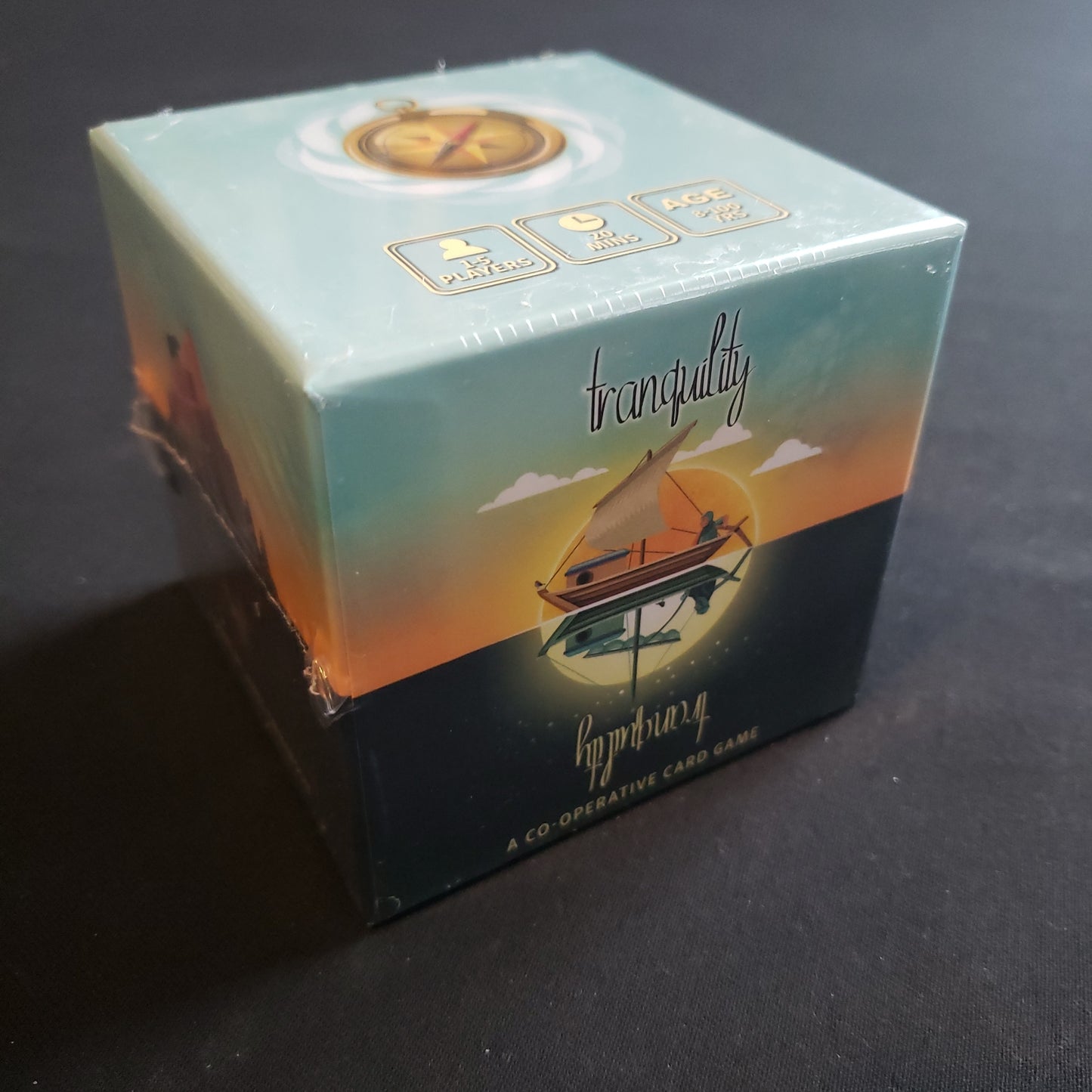 Image shows the front cover of the box of the Tranquility card game