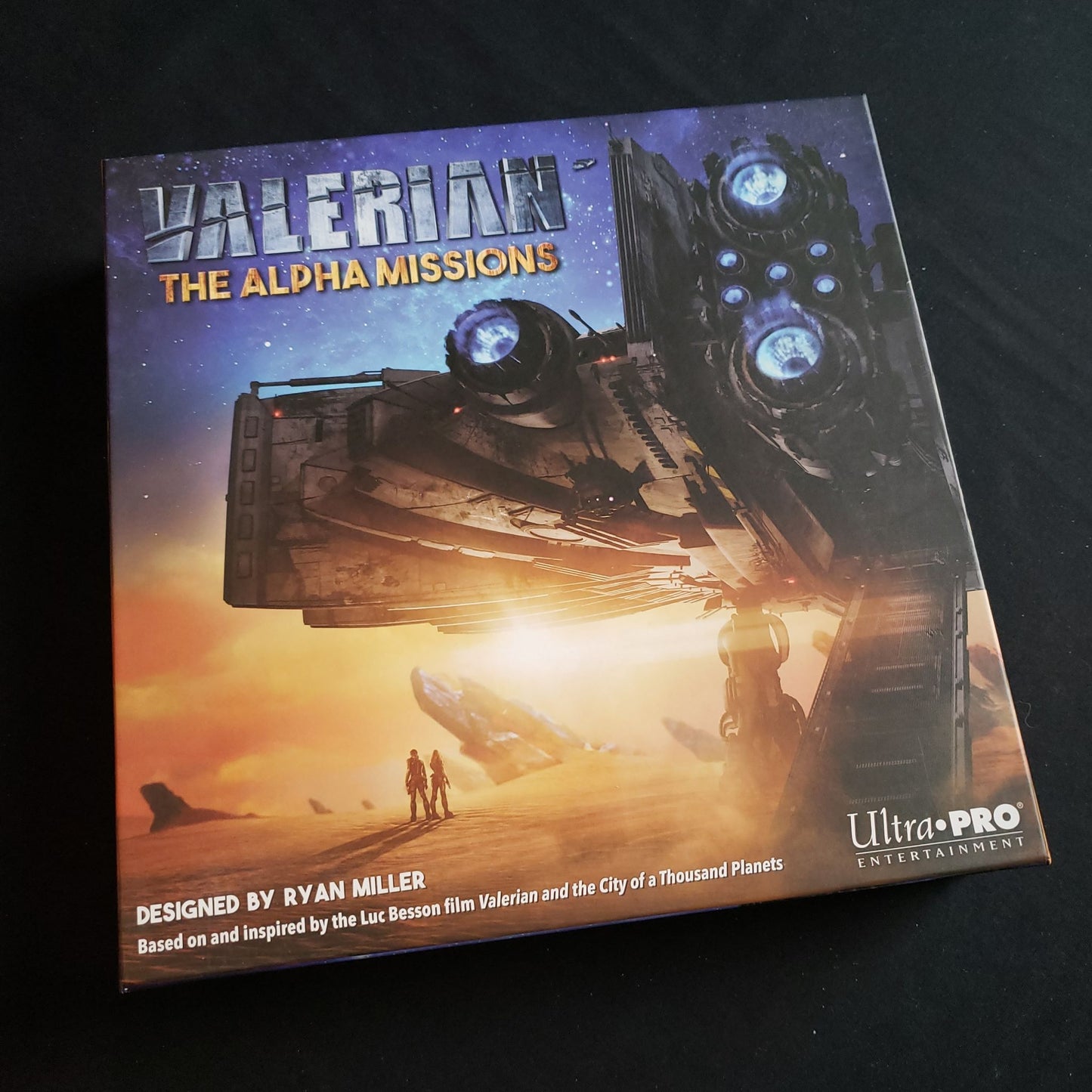 Image shows the front cover of the box of the Valerian: The Alpha Missions board game
