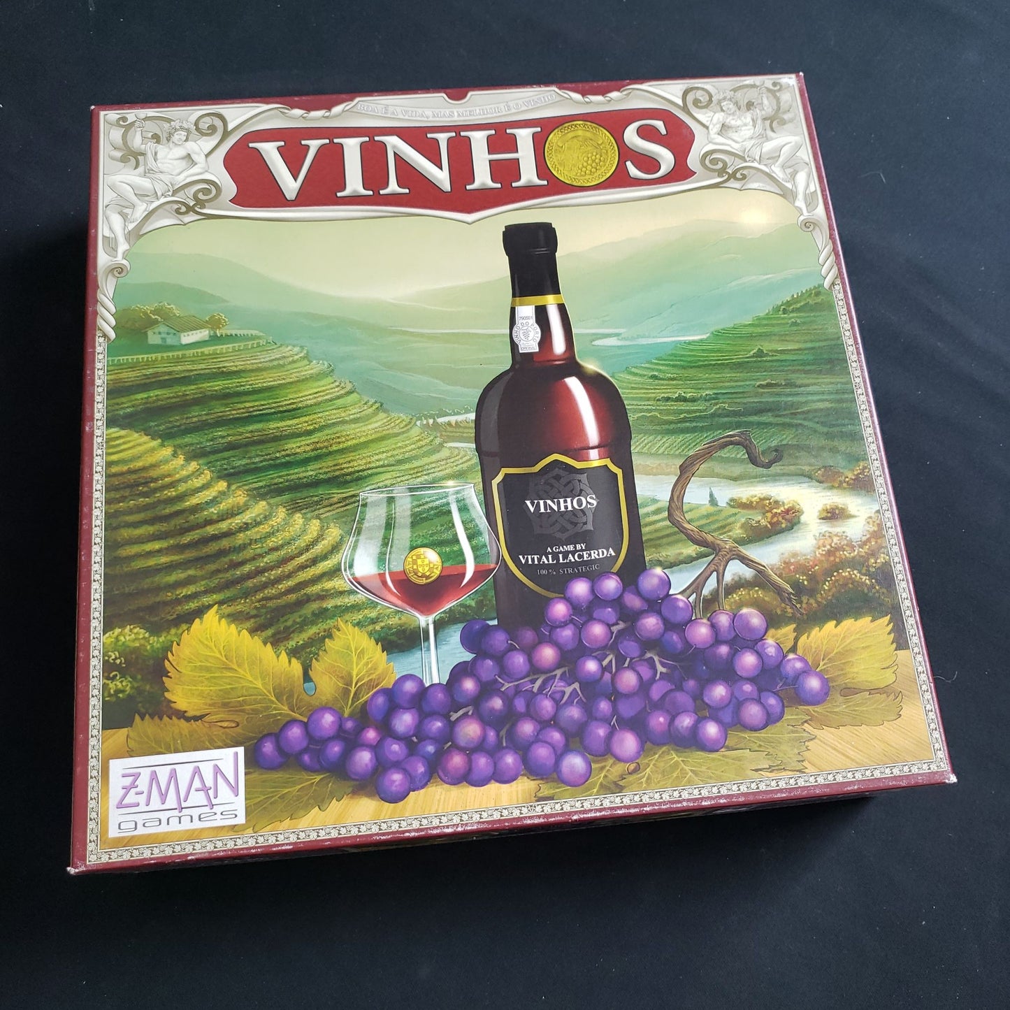 Image shows the front cover of the box of the Vinhos board game