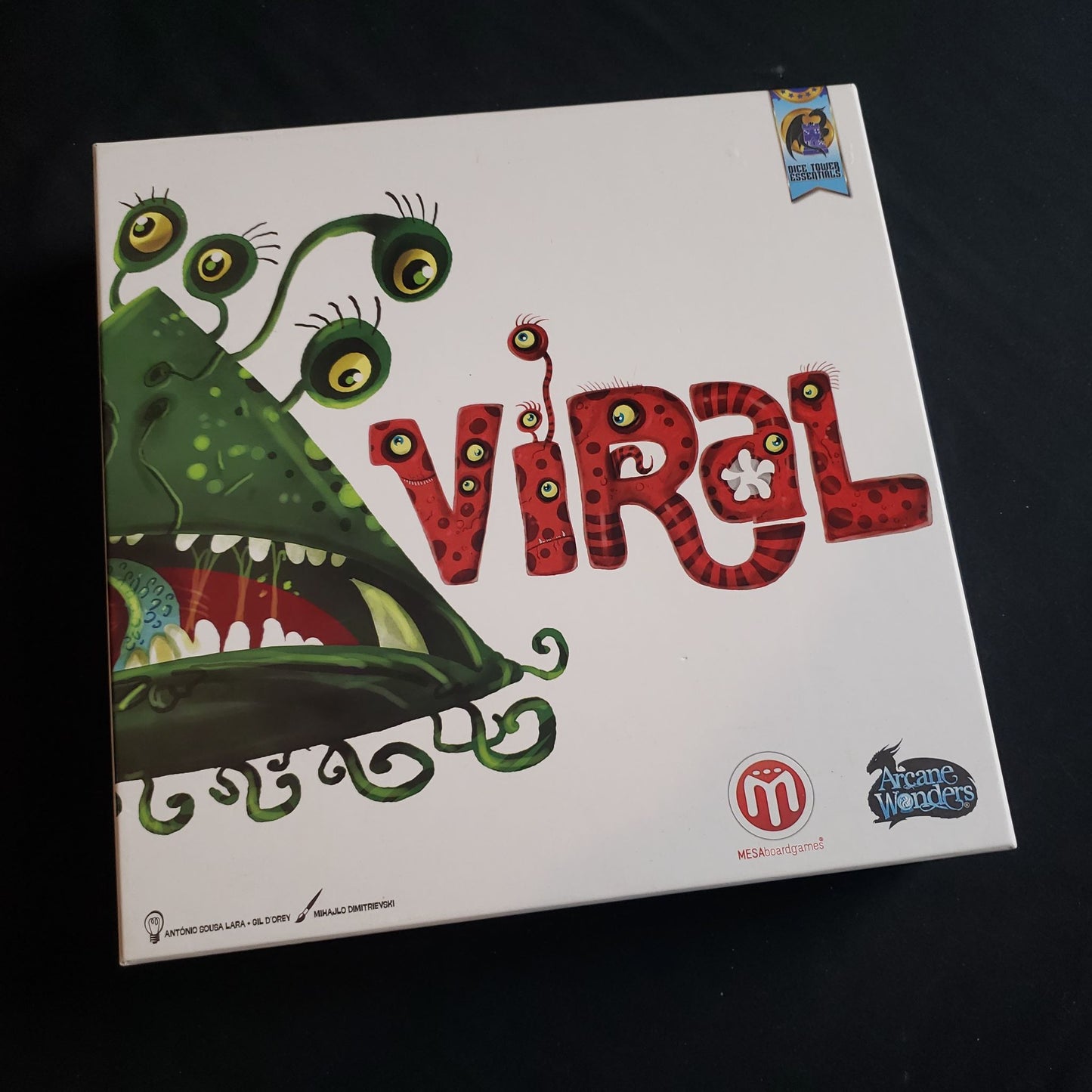Image shows the front cover of the box of the Viral board game