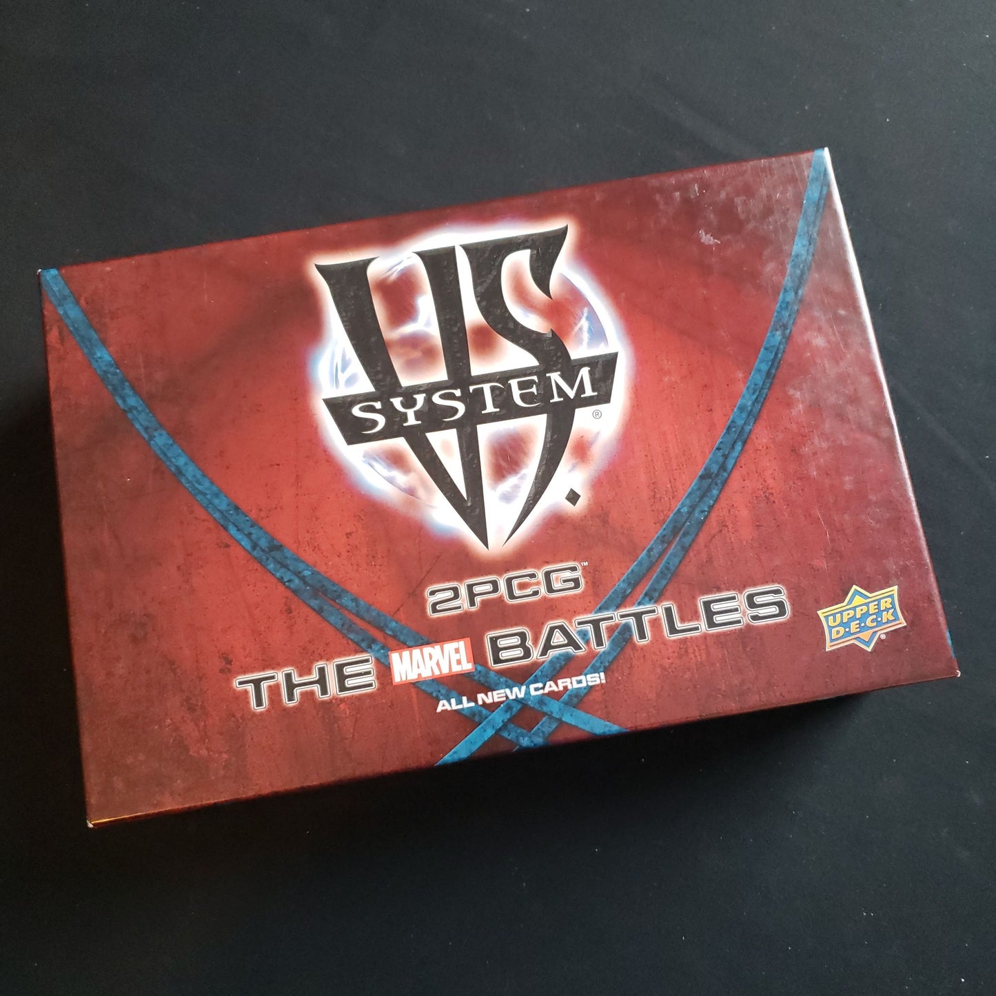 Image shows the front cover of the box of the VS System: The Marvel battles card game