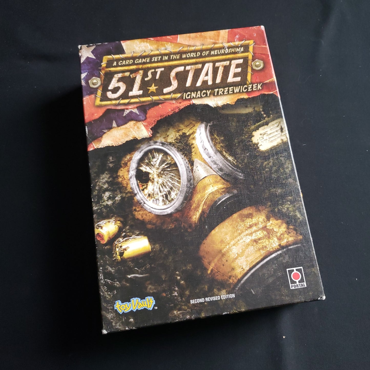 Image shows the front cover of the box of the 51st State card game