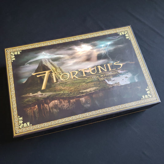 Image shows the front cover of the box of the Greek Mythology Edition of the board game 7 Fortunes
