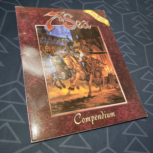 Image shows the front cover of the Compendium book for the roleplaying game 7th Sea