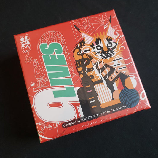Image shows the front cover of the box of the 9 Lives card game