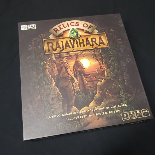 Image shows the front cover of the box of the Relics of Rajavihara board game
